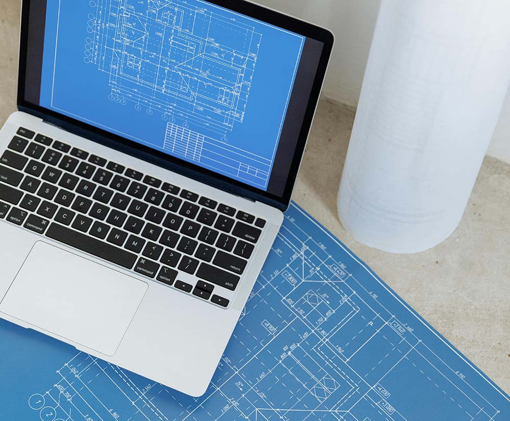 specialist engineering recruitment agency image showing plans on laptop
